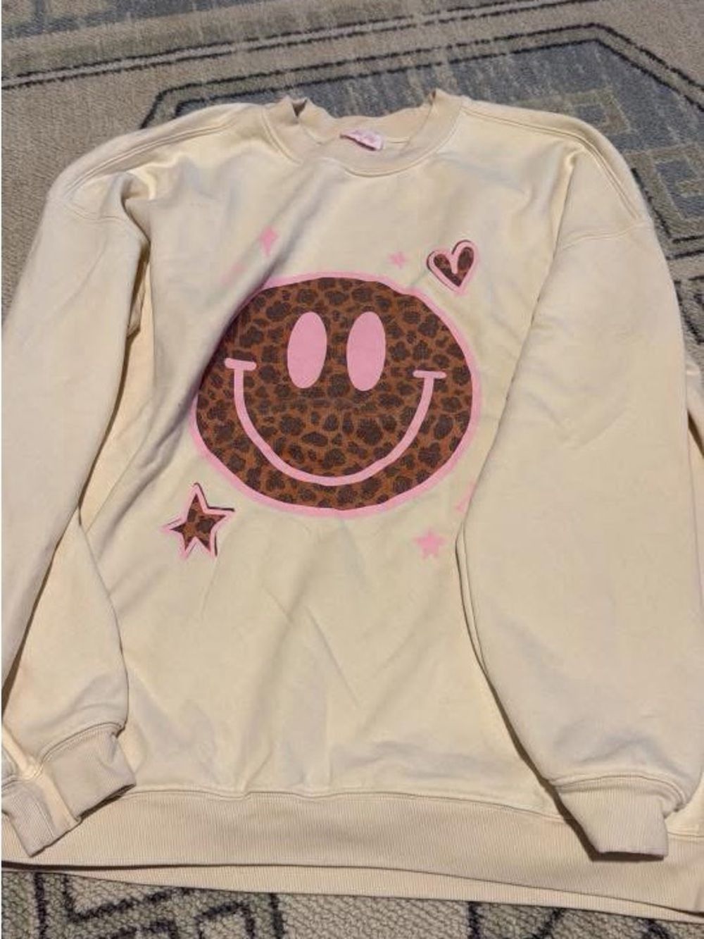 Pink Lily Cream Sweatshirt with Leopard Smile Graphic and Pink Accents